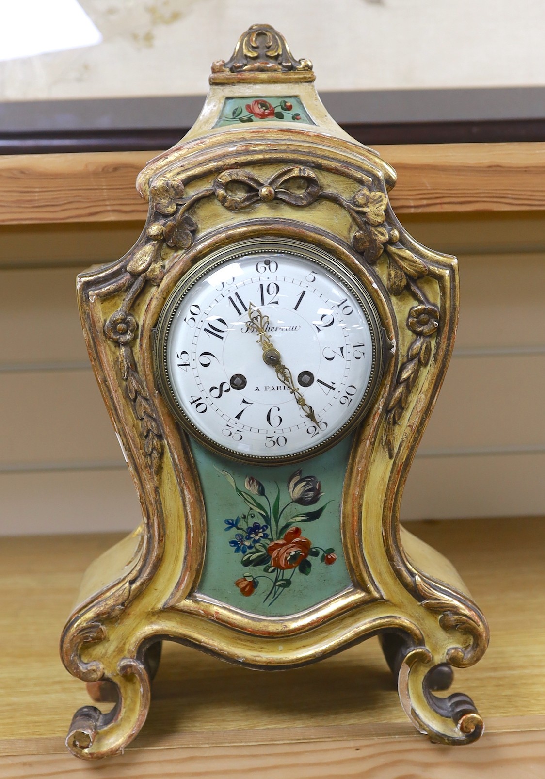 An early 20th century painted French mantel clock, 45cms high